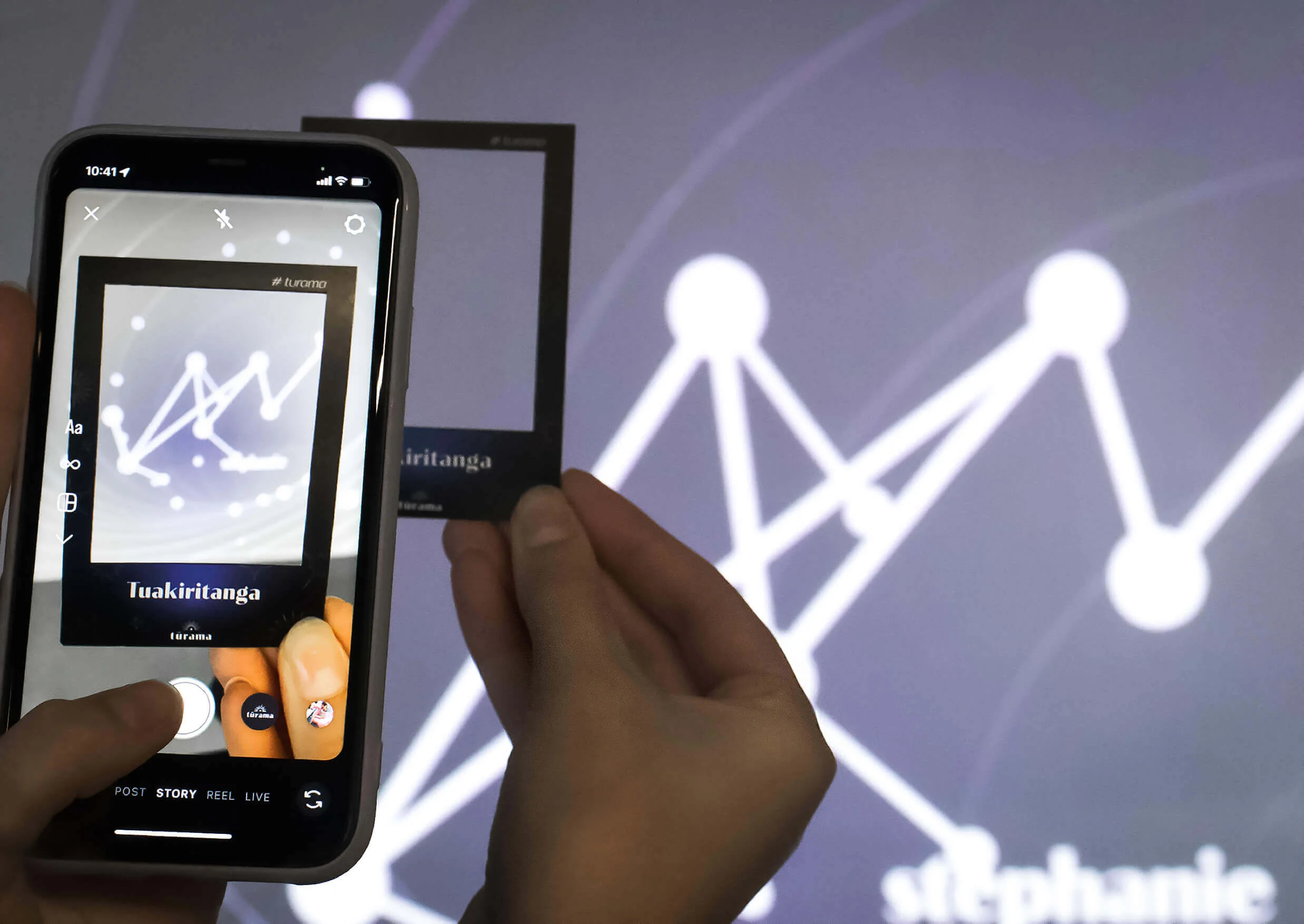 Someone using the photo-frames to capture their constellation